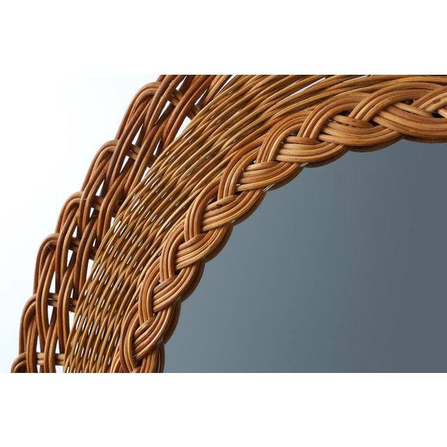 This charming mid‑century rattan mirror from 1960s France captures the effortless warmth and natural elegance that defined...