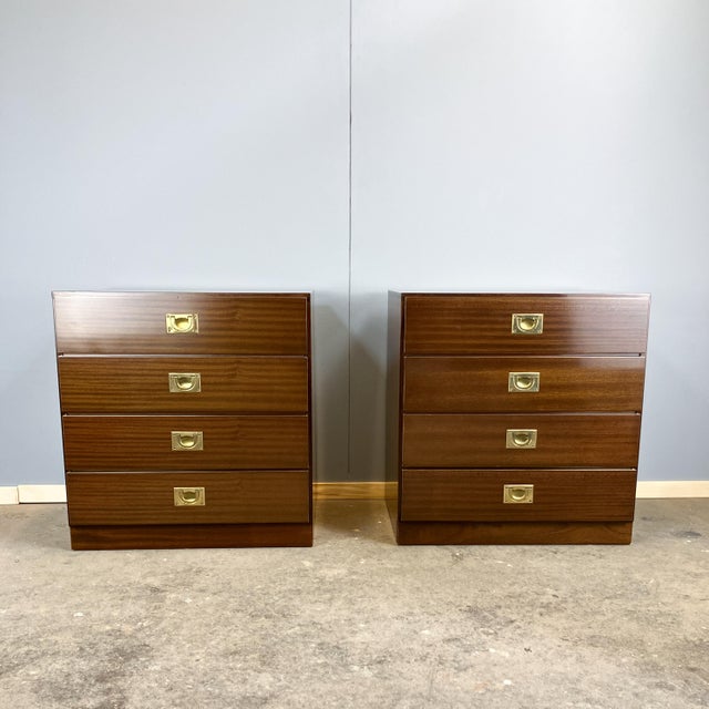 A pair of bedside tables in the typical functional design of the Campaign Style, which can also be used as small chests of...