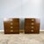 A pair of bedside tables in the typical functional design of the Campaign Style, which can also be used as small chests of...