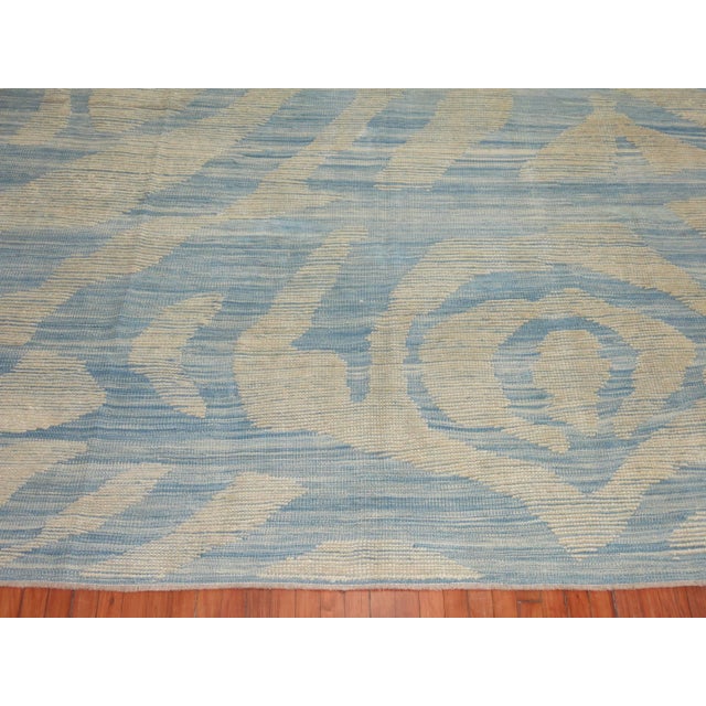 One of kind flat-weave Kilim with a modern design on sky blue ground. 9'10'' x 13'11''