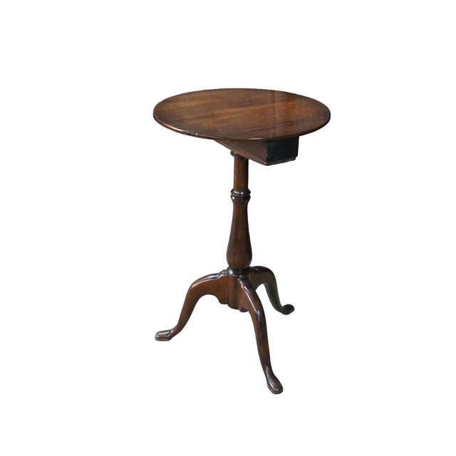 This is an antique Georgian Queen Anne style mahogany candle stand or side table dates to the 19th century. Features a...
