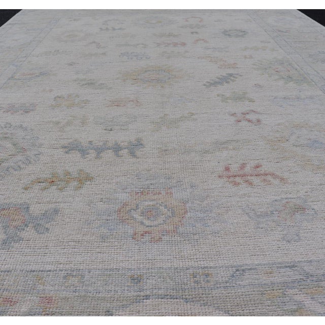 Taupe Large Oushak Rug With Floral Motifs & Muted Colorful Tones on Neutral Background For Sale - Image 8 of 12