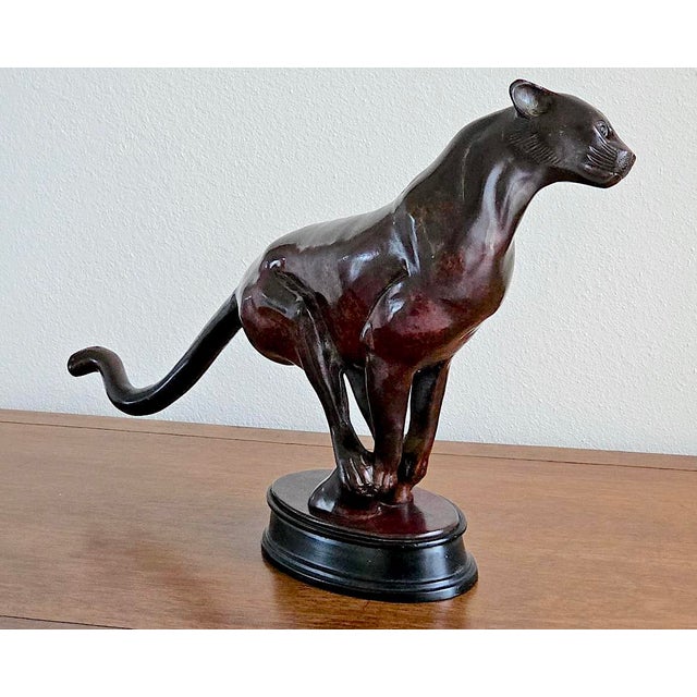 Capture the raw elegance and dynamic energy of the Art Deco era with this exceptional vintage-style bronze charging...