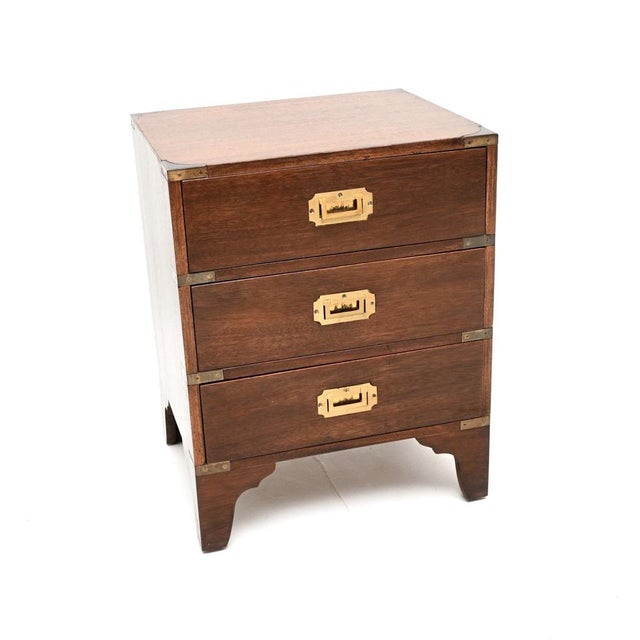 A smart and compact antique military campaign style chest of drawers. This was made in England, it dates from around the...