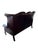 English high-back Chesterfield sofa in burgundy leather with deep button tufting, rolled arms, and nailhead trim. Raised...