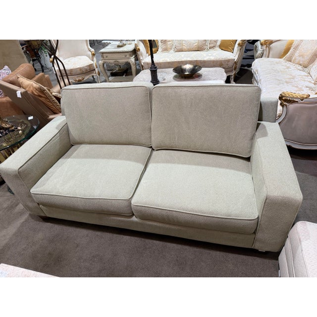 Understated sophistication meets everyday comfort in this beautifully tailored Norwalk sofa. Upholstered in a soft sage-...