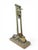 Elegant early 20th-century cigar guillotine cutter crafted in brass and wood, dating from the first half of the 1900s....