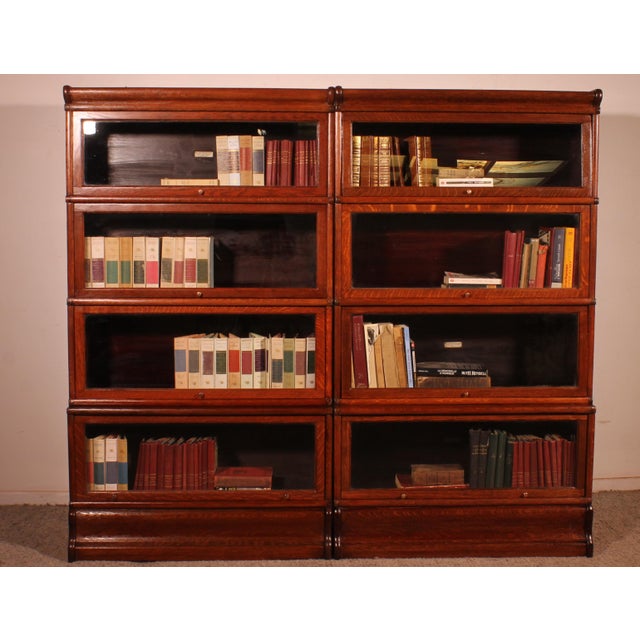 Elegant pair of Globe Wernicke London oak bookcases, late 19th/early 20th century, England. This charming pair of...