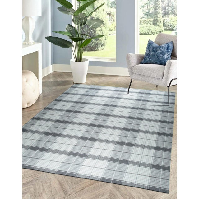 Lila Bianca Gray Flatweave Wool Rug, Country of Origin: India. This contemporary flatweave piece showcases the enduring...