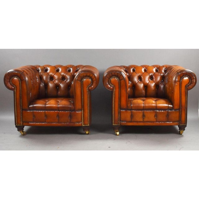Pair of Brown Leather Chesterfield Armchairs Item Code: LC18 A handsome pair of traditional Chesterfield armchairs,...