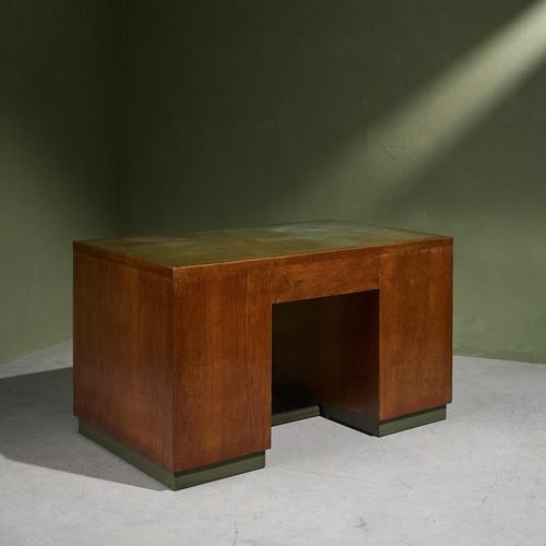 This 1940s Italian desk is made of partially solid and veneered oak and features a green linoleum laminated top, which...