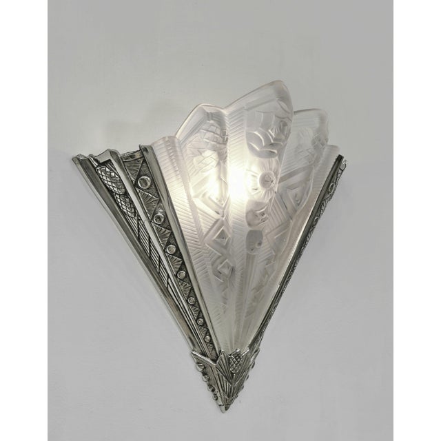 NOVERDY wall sconces A pair of large 1925-1935 French art deco wall lights. The solid brass mounts hold two beautiful...