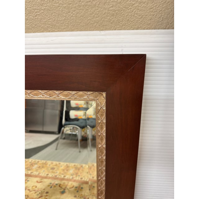 Design Plus Gallery presents an Etched Frame Wall Mirror of Mahogany and Silver Gilt. The mirror is oversized with a thick...