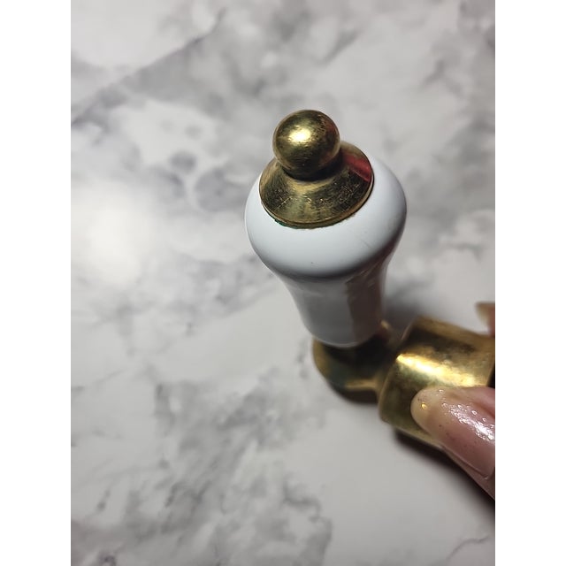 Widespread bathroom faucet - Handles are white ceramic on a brass base. Traditional faucet spout. Quality construction