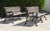 A matched pair of vintage garden benches with ornate cast-aluminum frames and hardwood slats. The substantial scrolling...