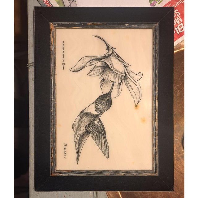 Borgreen the artist, hand etched black ink hummingbird and flower on white marble. has a black velvet 1.5 frame on wood...
