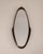 Defined by its elongated sculptural frame, this Italian wall mirror transforms a functional object into a carefully...