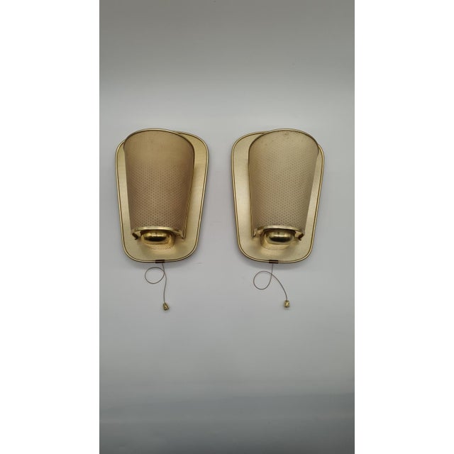 A pair of No. 430 wall lamps from the 1960s, designed by Erco Leuchten in Germany, combines the clean form of mid-century...