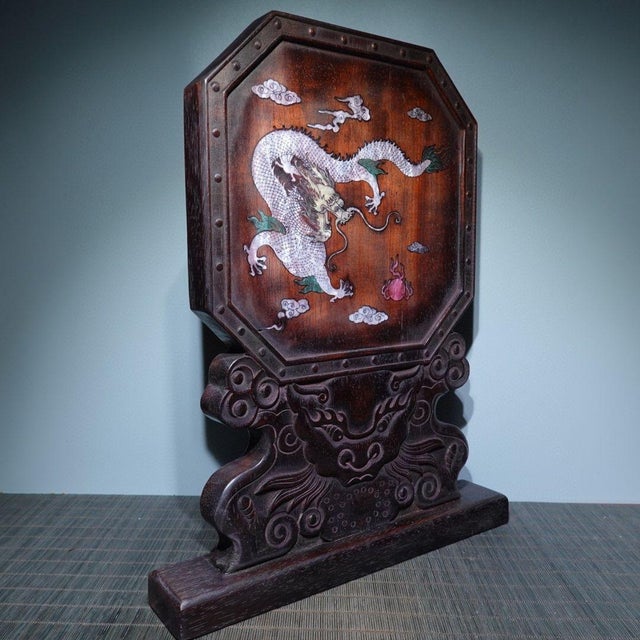 This is a stunning vintage Chinese Ebony table screen, featuring exquisite Mother-of-Pearl (MOP) inlay. The screen...