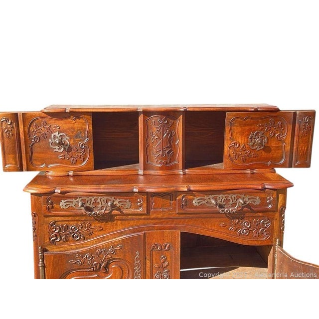 This antique 19th century French dark walnut carved sideboard buffet cabinet server is a stunning piece of furniture....