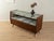 A wonderful shop counter from the 1950s. Its body is made of walnut veneer, with eight drop-leaf doors, eight drawers with...
