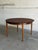 This versatile dining furniture pieces features a circular top that expands into a spacious elongated oval. The minimalist...