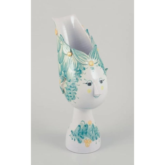 Bjørn Wiinblad (1918-2006). Vase in the form of a woman's head, in multicolored ceramic. Glaze in green and yellow. Signed...