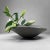A large ikebana bowl crafted in wood-fired stoneware, produced at a Japanese studio pottery kiln in the 1970s. Dimensions:...