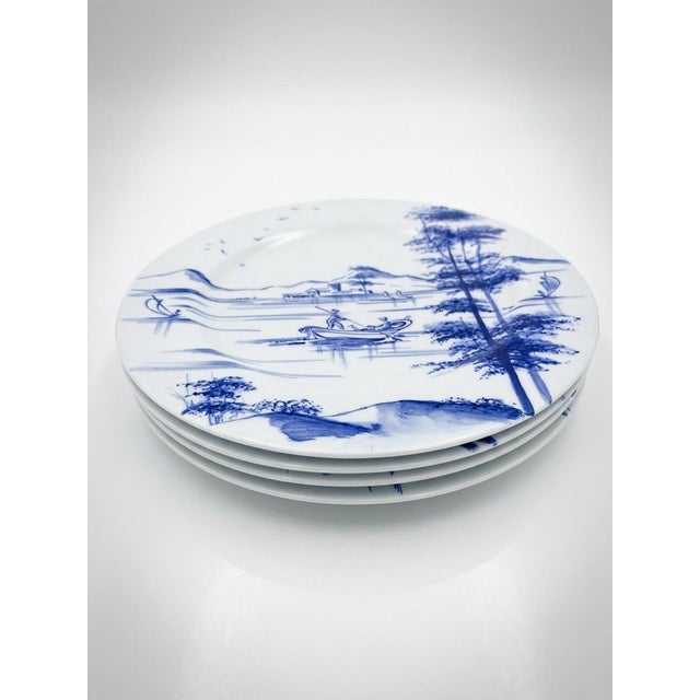 An exquisite and rare set of four vintage ceramic plates handcrafted and meticulously hand-painted by the revered...