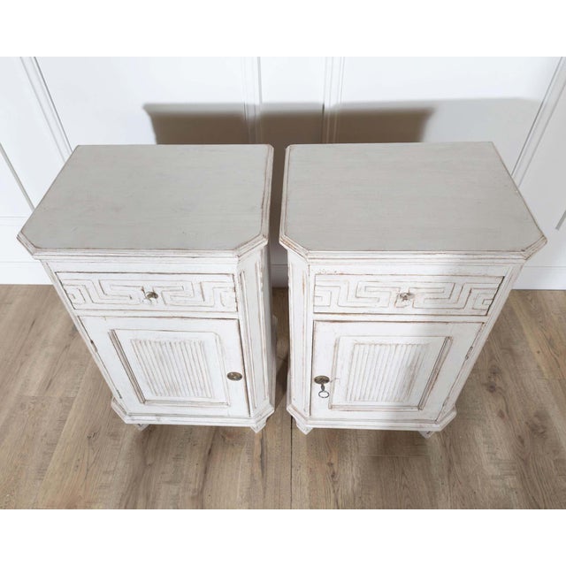 A charming pair of Swedish painted nightstands dating to circa 1880, showcasing the refined elegance of the Neoclassical...