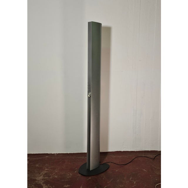 Dimmable "Echos" floor lamp designed by Jan Van Lierde for Artemide, dating back to the 1980s. Made of metal, the lamp is...