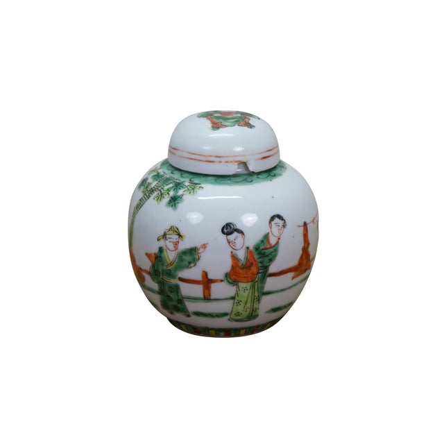 Two antique Chinese Qing Dynasty famille verte ginger jars / urns, featuring hand-painted enamels on porcelain. The...