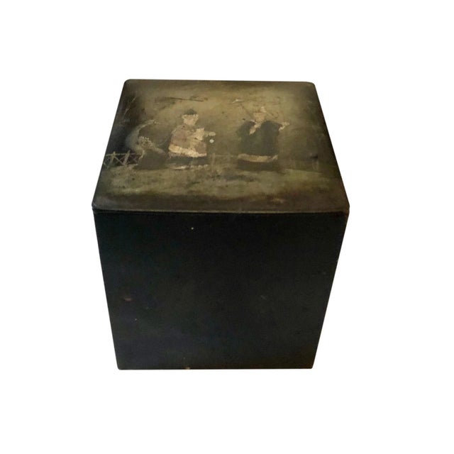 A black papier mâché tea box with monograms on all four sides and figures on top. Russian, circa 1880s.