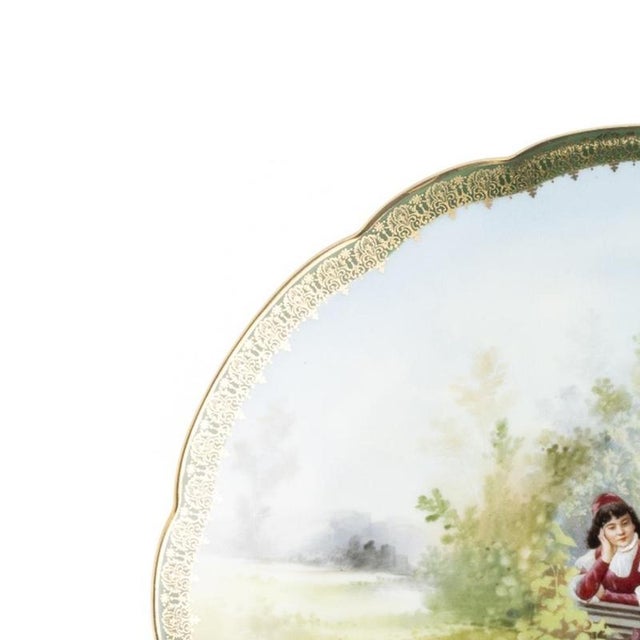 Porcelain plate. Austrian, 20th century, in porcelain, polychrome and gold decoration depicting a landscape with figures...