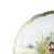 Porcelain plate. Austrian, 20th century, in porcelain, polychrome and gold decoration depicting a landscape with figures...