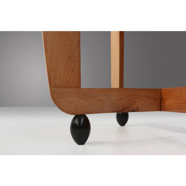 This 1920s Amsterdam School beech side table embodies the sculptural boldness and expressive craftsmanship that defined...