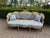 An elegant 1940 European French Louis XVI-style sofa set, fully handmade from solid beech wood and consisting of one...