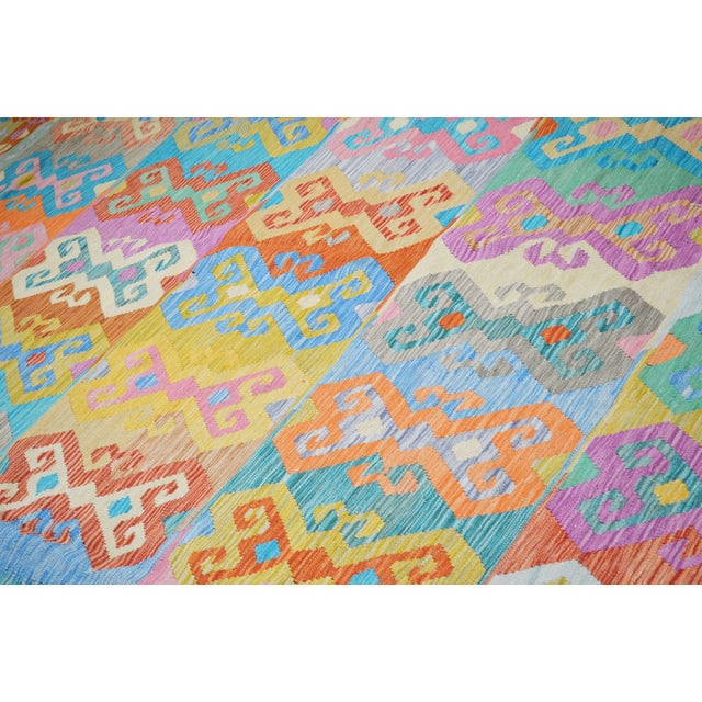 Hand-knotted with care using traditional rug making techniques, this wool rug blends timeless craftsmanship with a modern...