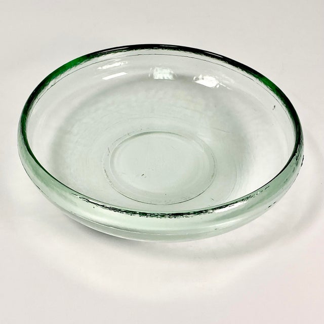 This is a lovely hand-blown glass Mexican glass serving bowl. The glass has a Celadon green tint. The bowl is round and...
