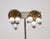 1950s round goldtone "woven" texture back with three white resin drops with filigree tops and bottoms clip back earrings....