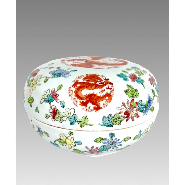 A sizeable and rather magnificent hand painted white porcelain covered bowl from China, hand painted with red pheonix and...