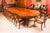 This is a fantastic vintage Victorian Revival marquetry dining table. The table is made from burr walnut, which has a...