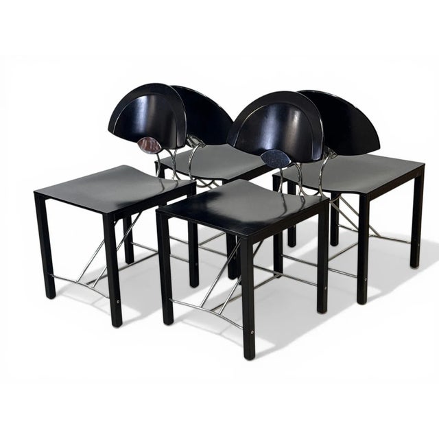Italian Postmodern Ebonized &amp; Chrome Dining Chairs Italy | c. 1980s | h. 31.5" x w. 17" x d. 20" | Set of 4 A striking...