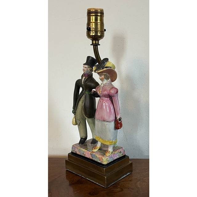 Antique early 19th century English Staffordshire figure of a Regency couple mounted as a table lamp with weighted brass...