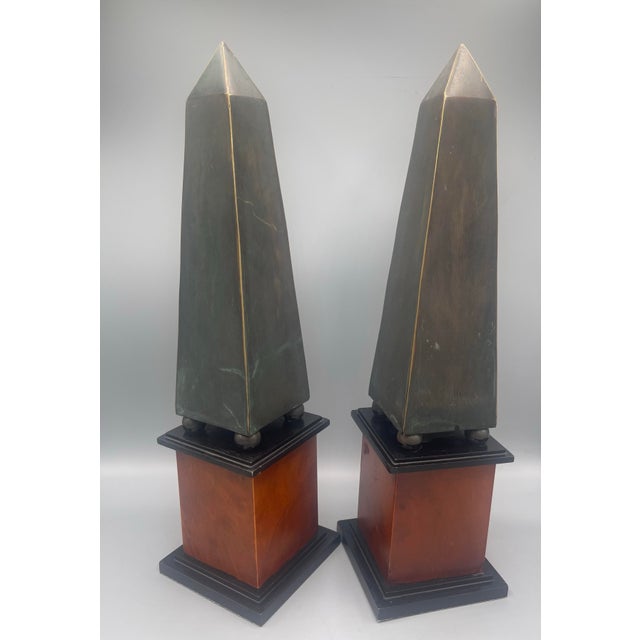 Striking pair of late 20th-century decorative obelisks by Decorative Crafts, Inc., from their Hand-Crafted Imports...