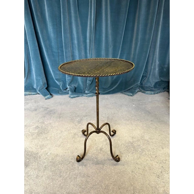 This ornate and unusual Spanish gilt metal side or drinks table was recently handcrafted by skilled artisans using...