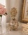 Vintage French style glass perfume bottle adorned with elaborate gilt metal floral filigree and an exceptional openwork...
