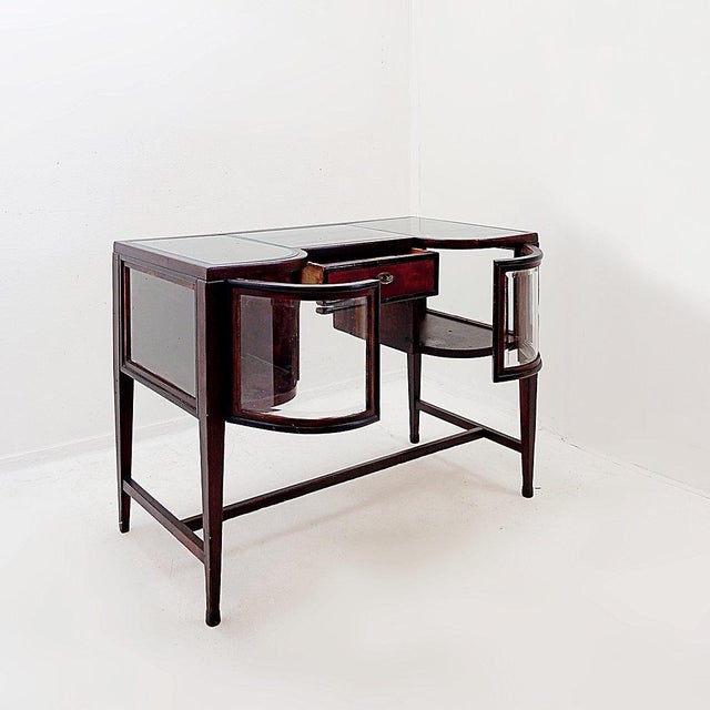 Antique - Decoration - 20th Measures : 100x52cm H:74cm This Art Deco wooden console table features a symmetrical design...