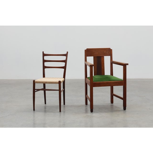 An elegant example of Dutch Amsterdamse School design, this oak side chair embodies the architectural rigor and expressive...
