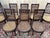 A Louis XVI style dining room set comprising six chairs and two armchairs in solid mahogany, restored. The set displays...